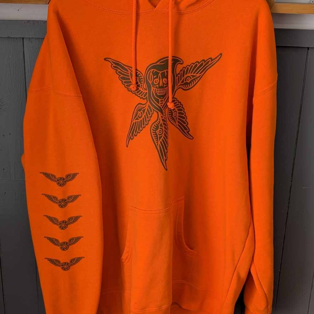 Vibrant Orange Sweatshirt with Graphic Design
